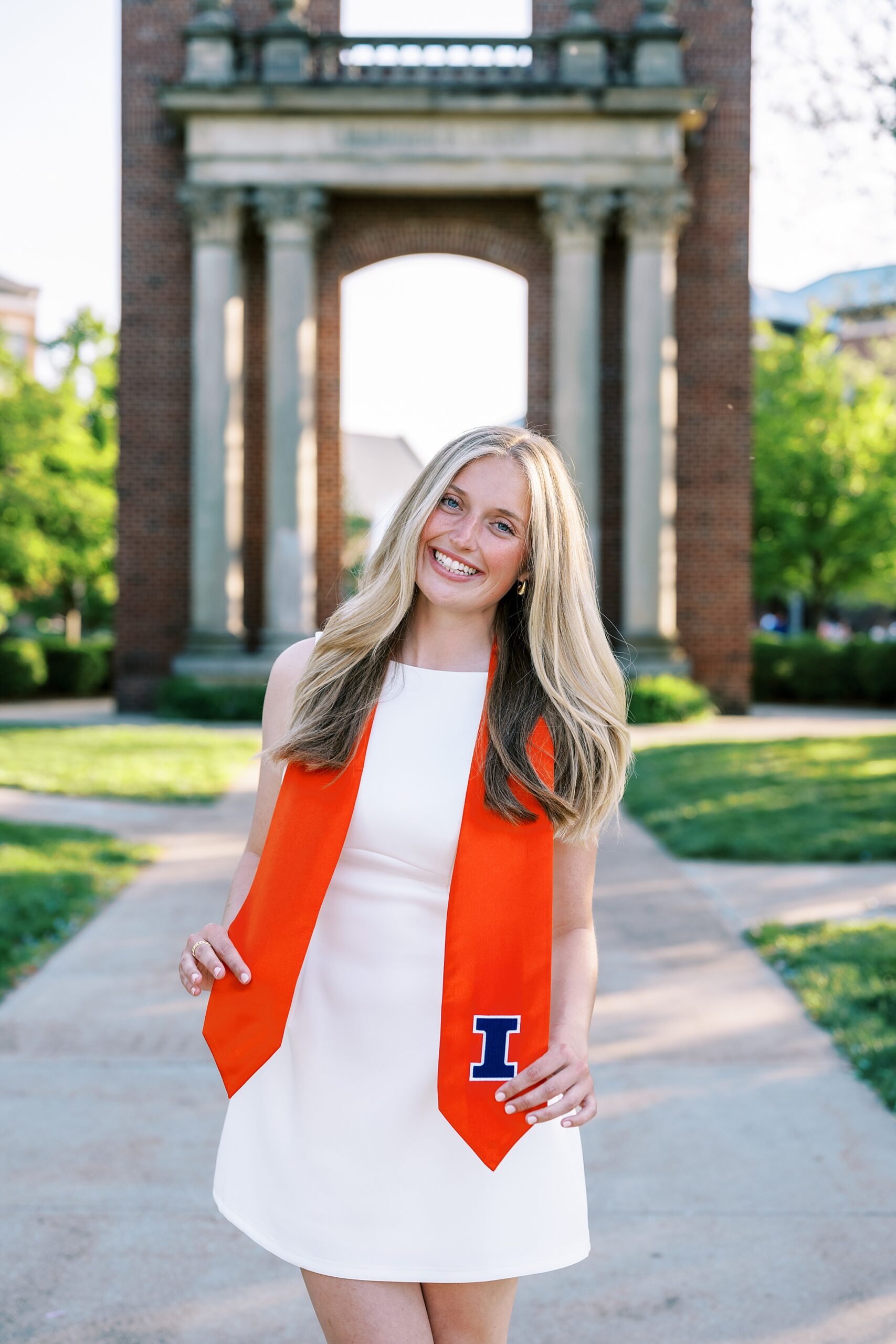Graduation portraits at the University of Illinois in Champaign-Urbana featuring cap and gown photos at iconic UIUC locations by Kim Ritchie Photography.