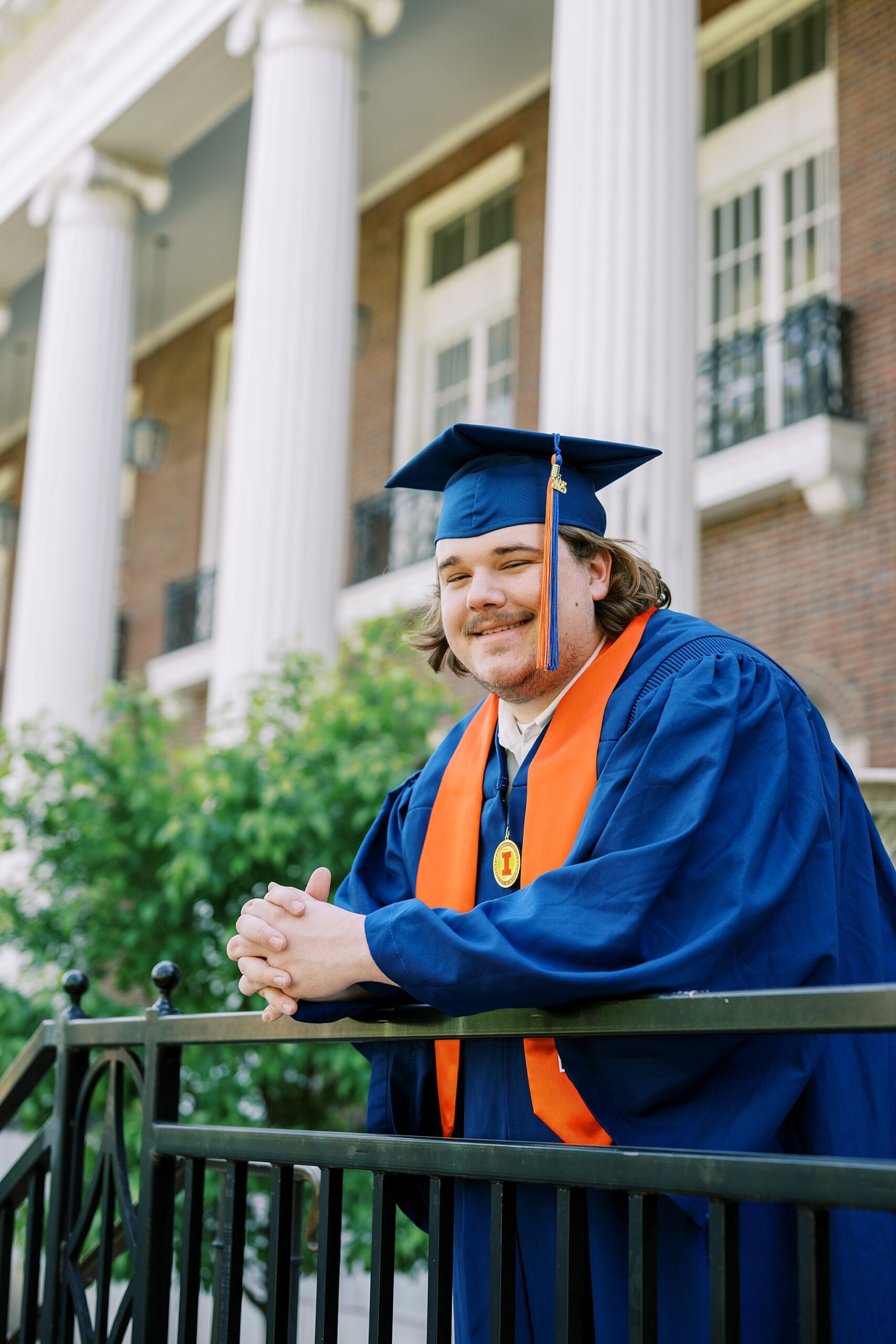 Graduation portraits at the University of Illinois in Champaign-Urbana featuring cap and gown photos at iconic UIUC locations by Kim Ritchie Photography.