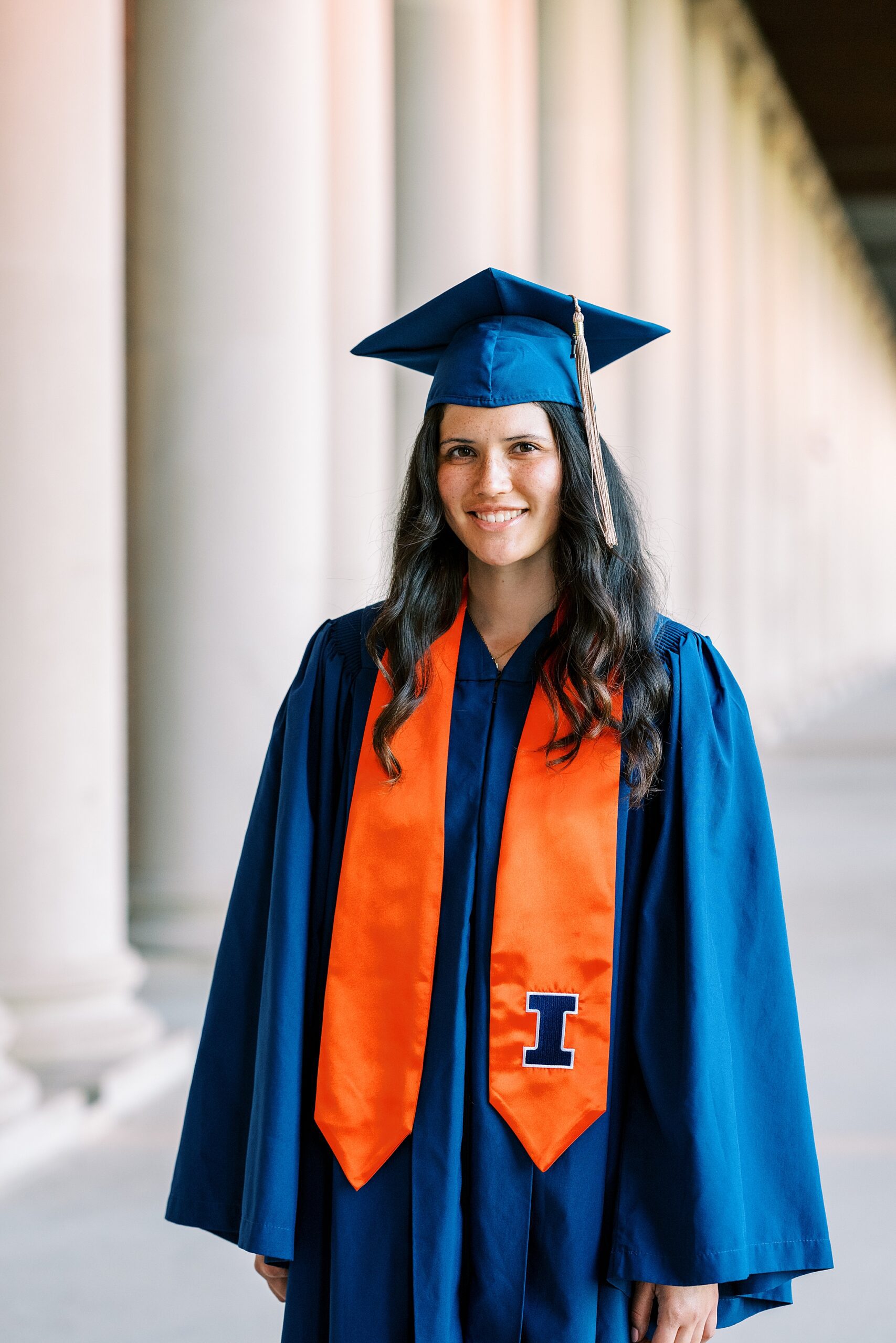 Graduation portraits at the University of Illinois in Champaign-Urbana featuring cap and gown photos at iconic UIUC locations by Kim Ritchie Photography.