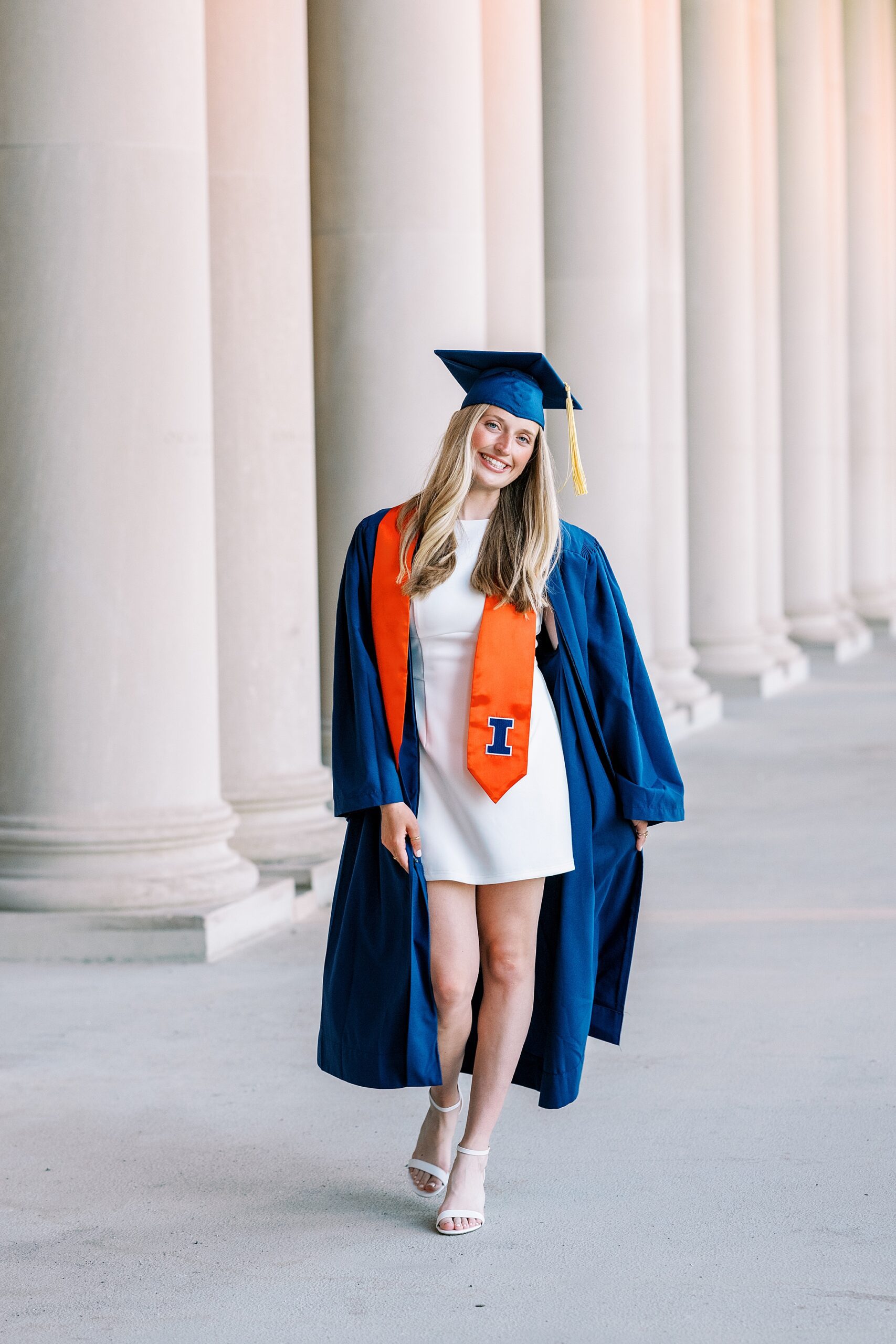 Graduation portraits at the University of Illinois in Champaign-Urbana featuring cap and gown photos at iconic UIUC locations by Kim Ritchie Photography.