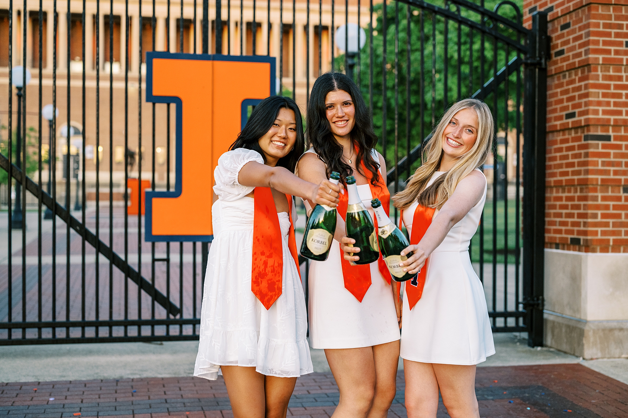 Graduation portraits at the University of Illinois in Champaign-Urbana featuring cap and gown photos at iconic UIUC locations by Kim Ritchie Photography.