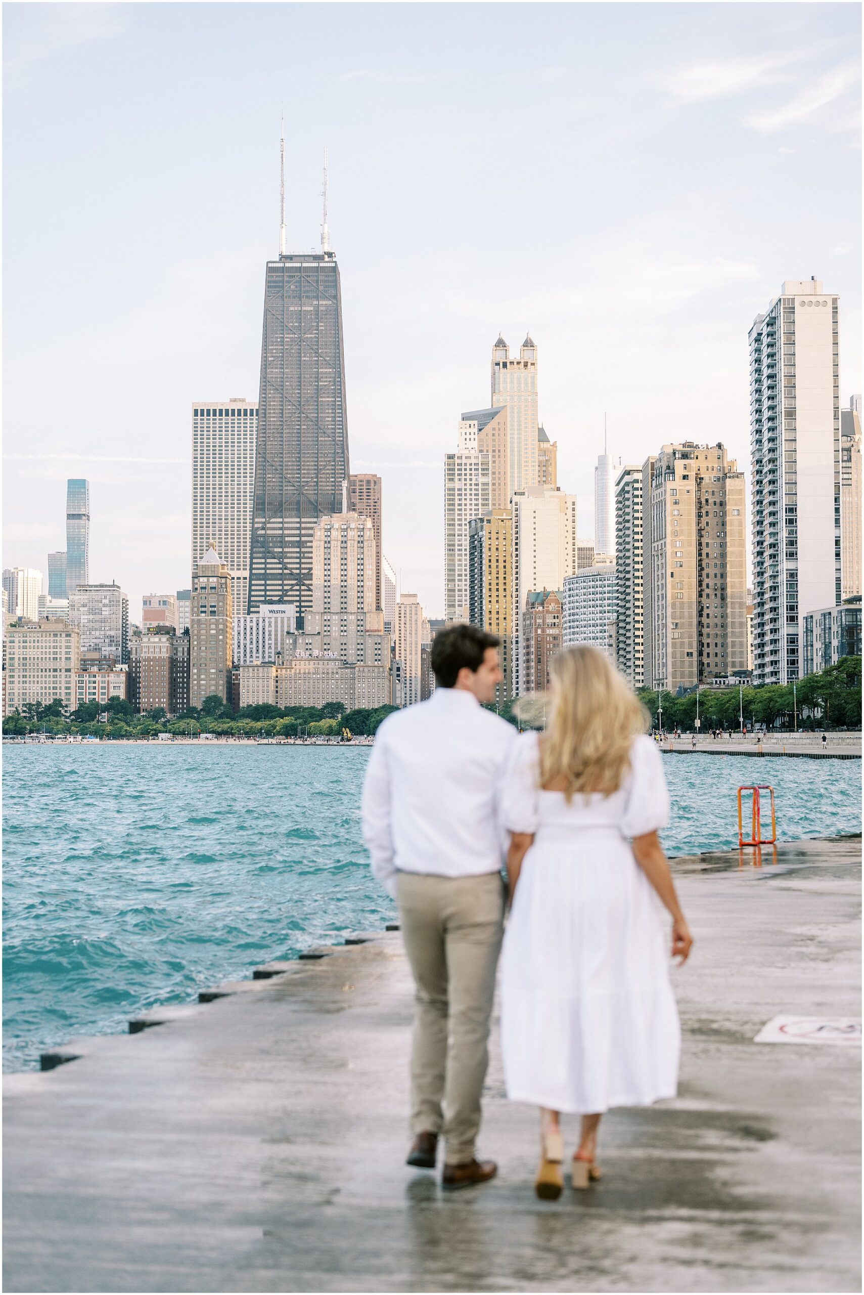 Chicago summer engagement photos at The Wrigley Building & North Avenue Beach with Chicago wedding photographer Kim Ritchie Photography.