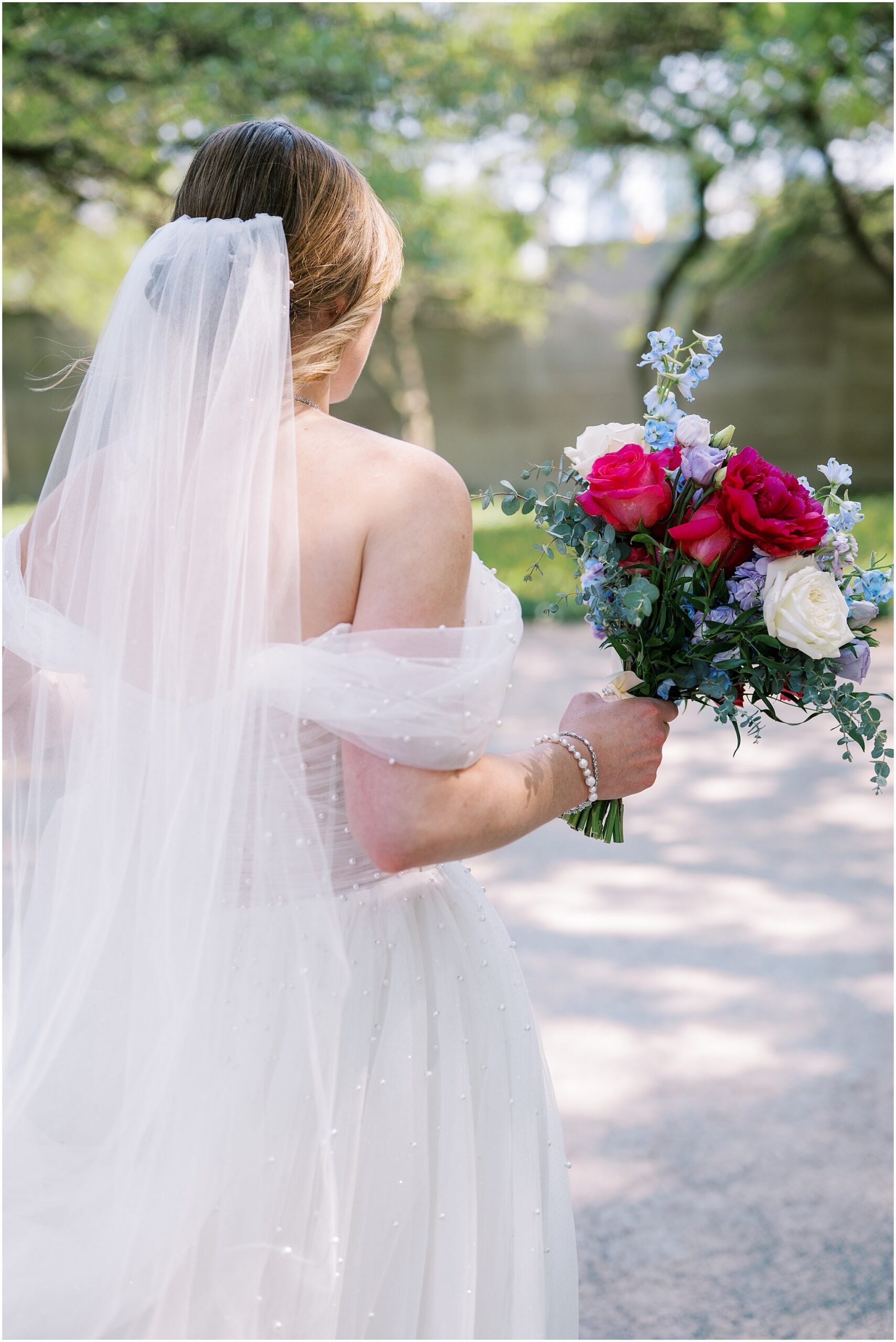 Katelyn & Eric’s early summer Adler Planetarium wedding in Chicago featured skyline views, golden hour glow, colorful details, and a joyful celebration.