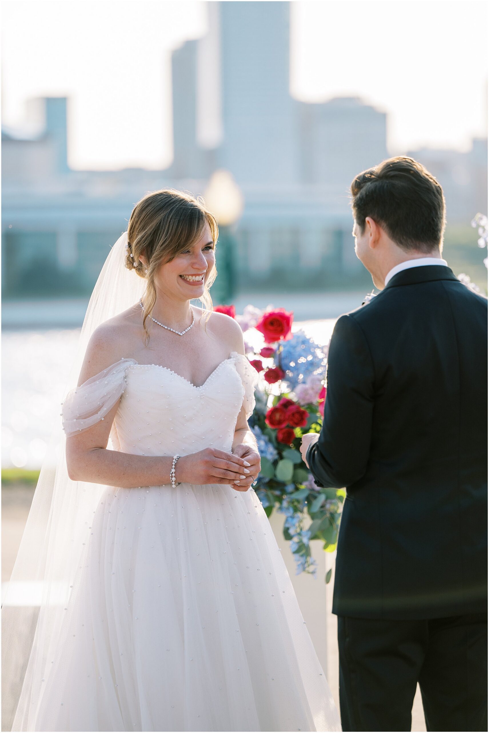 Katelyn & Eric’s early summer Adler Planetarium wedding in Chicago featured skyline views, golden hour glow, colorful details, and a joyful celebration.